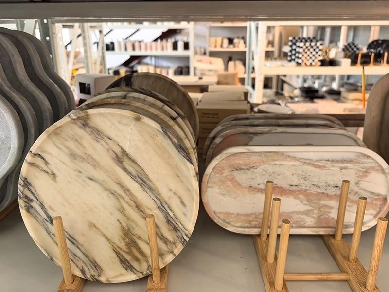 Marble trays and bowls on display in the company showroom, from its home accessories page