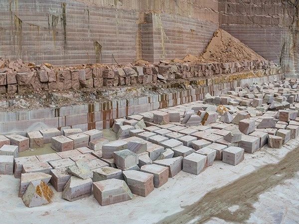 Granite blocks and benches at a quarry face, from the company's Granite Factory and Quarry page