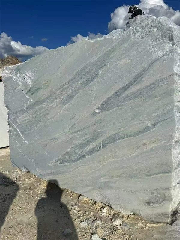 Marble blocks stacked in the block yard under an open sky, from the company's Marble Factory and Quarry page